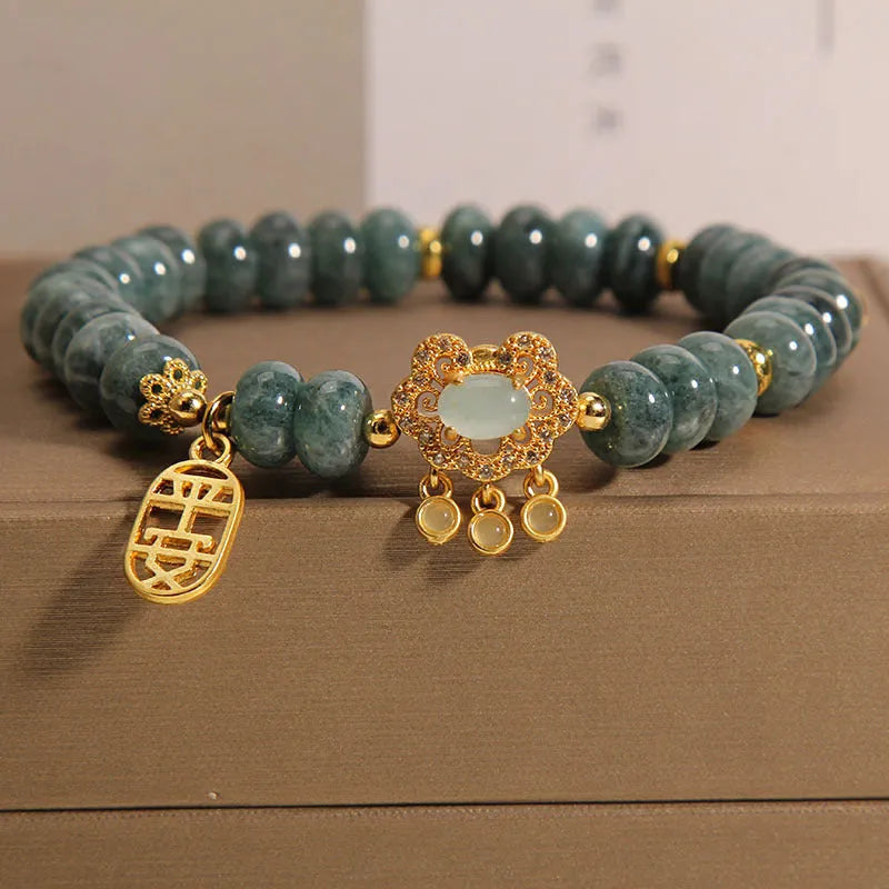 Women's natural emerald jade bracelet with abacus beads and safety lock closure
