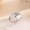 Silver electroplated copper adjustable heart ring for women on white background