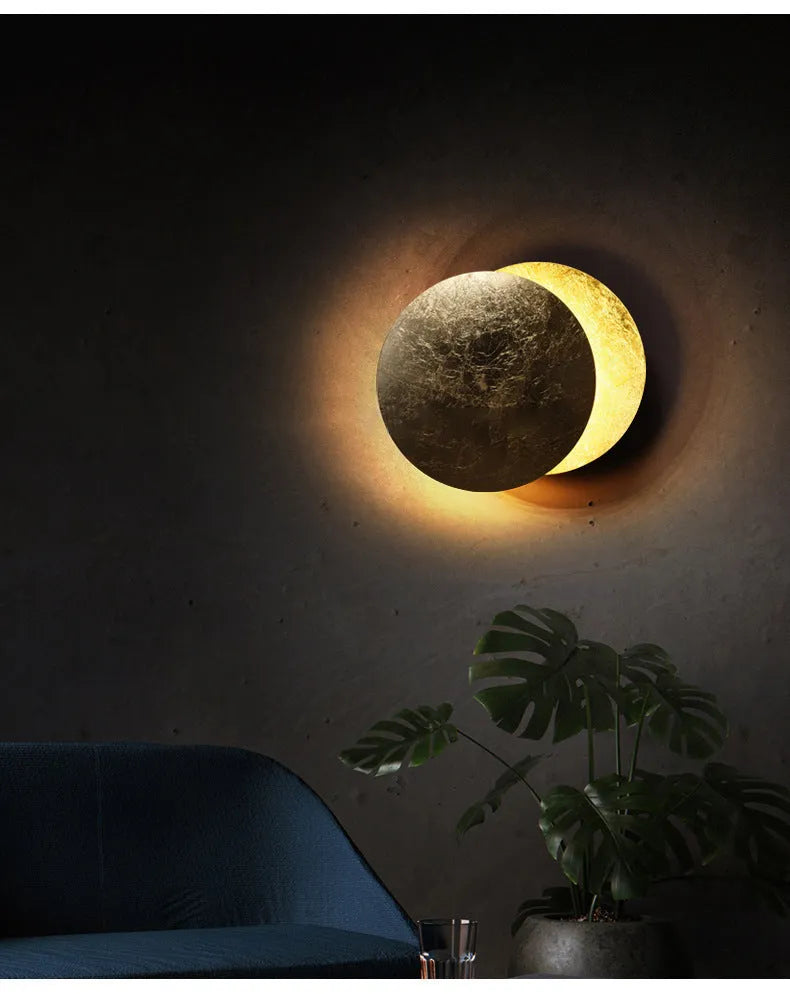 Modern minimalist aluminium bedside lamp in gold and black, shown in 20cm and 25cm diameter options.