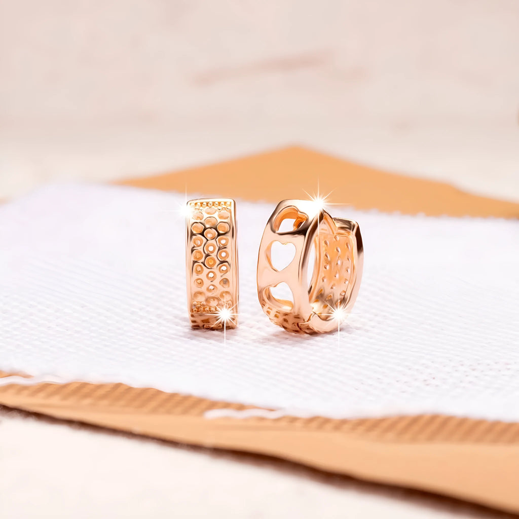Rose gold hollowed-out heart earrings with three heart design and circular shape