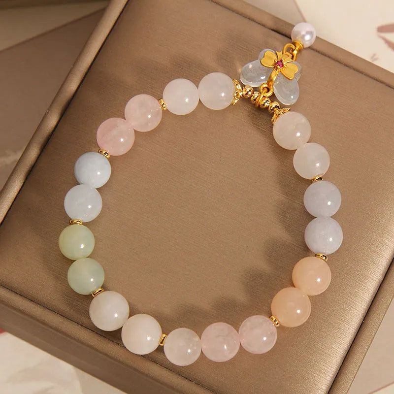 Women's crystal bracelet with butterfly pendant featuring natural morganite stones in candy colours