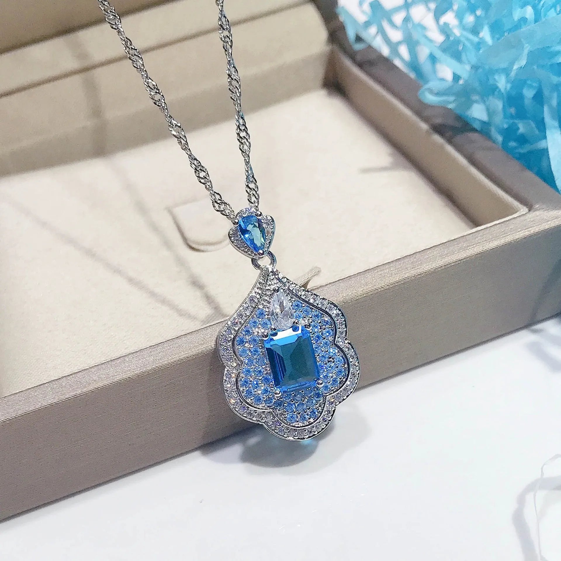 Sea blue geometric copper pendant with aquamarine and topaz mirror finish jewellery piece