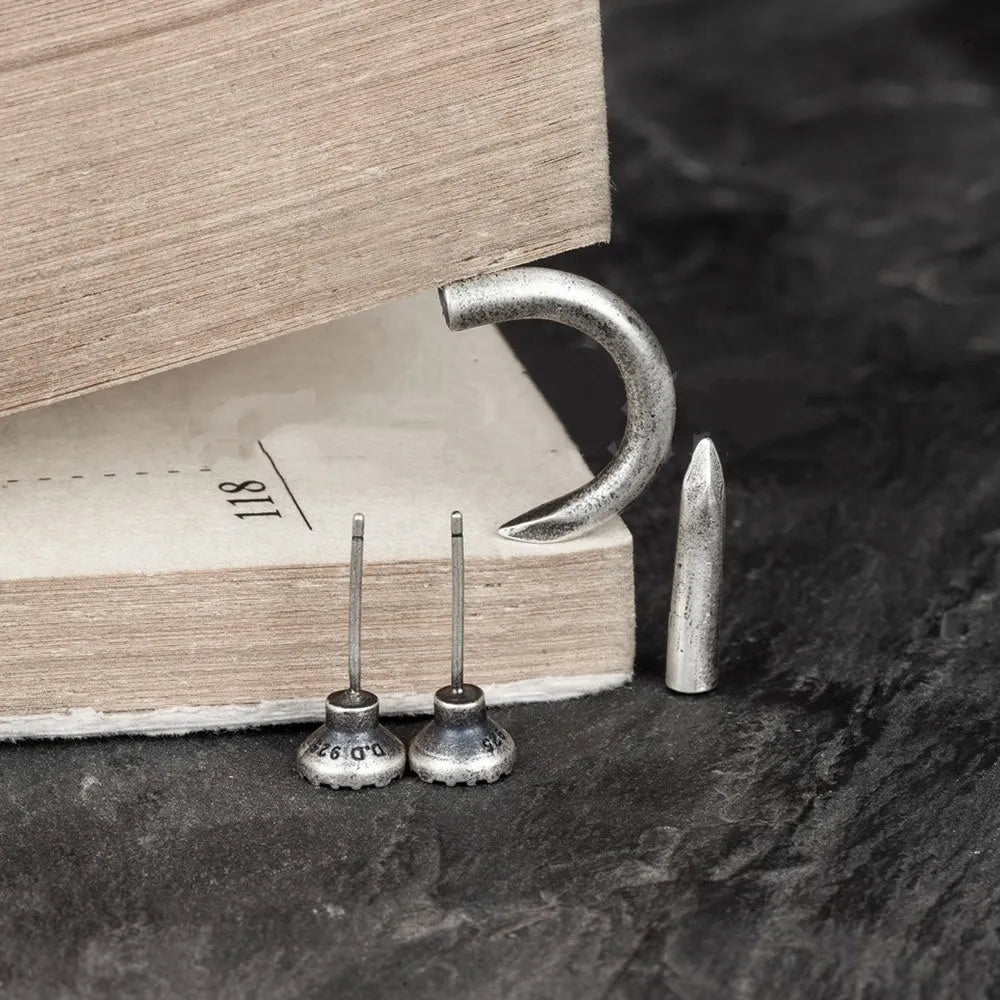 S925 sterling silver nail earrings in straight and curved punk stud designs with ear hook closures