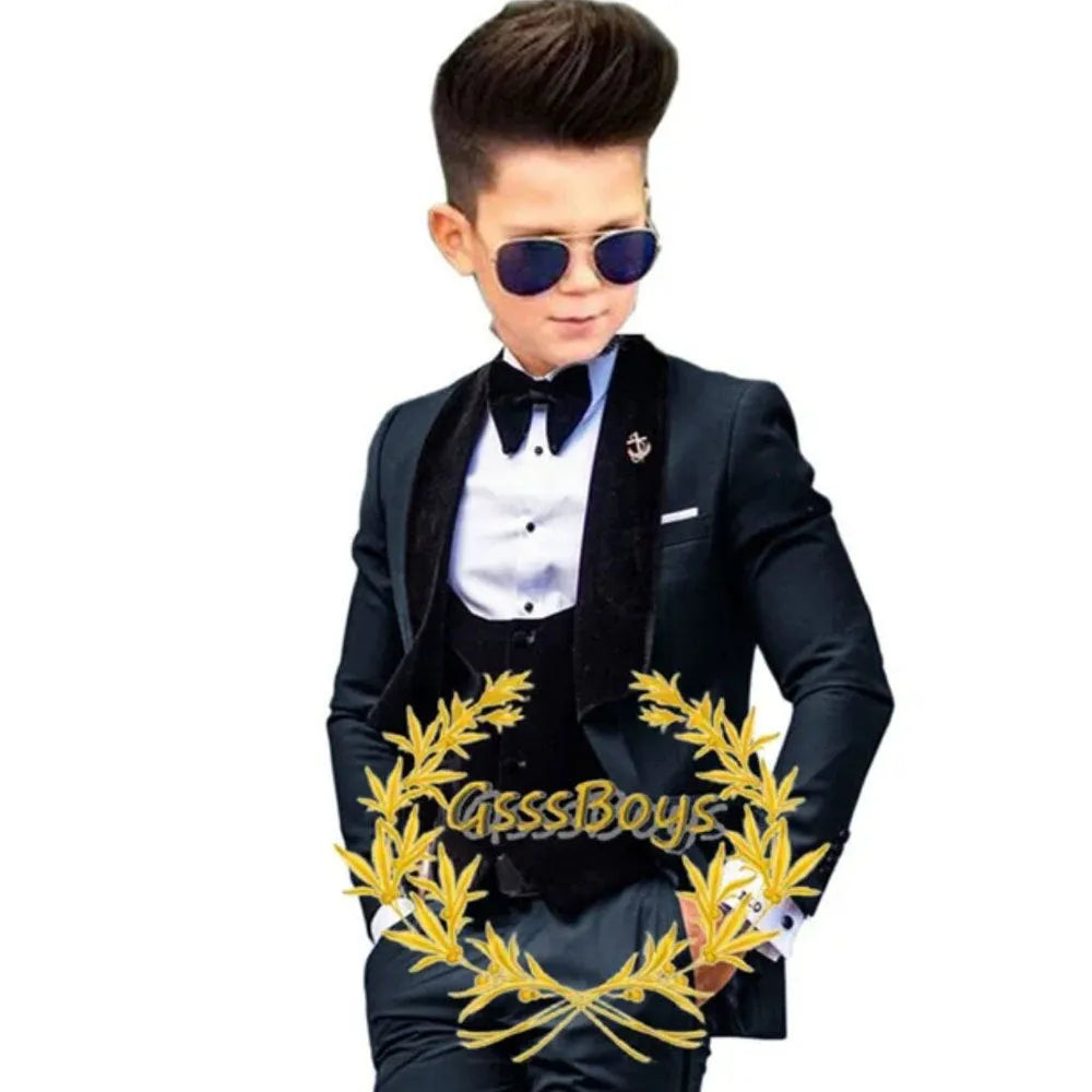 Boys' three-piece suit set in polyester fibre, including jacket, vest, and trousers, available in multiple colours and sizes from 3T to 16T.