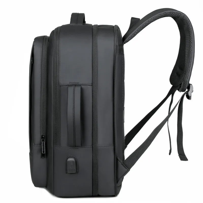 Black or grey large waterproof oxford cloth backpack with curved shoulder straps.
