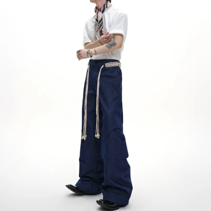 Men's dark blue straight-leg cotton jeans with heavy 3D belt stitching and zip decoration.