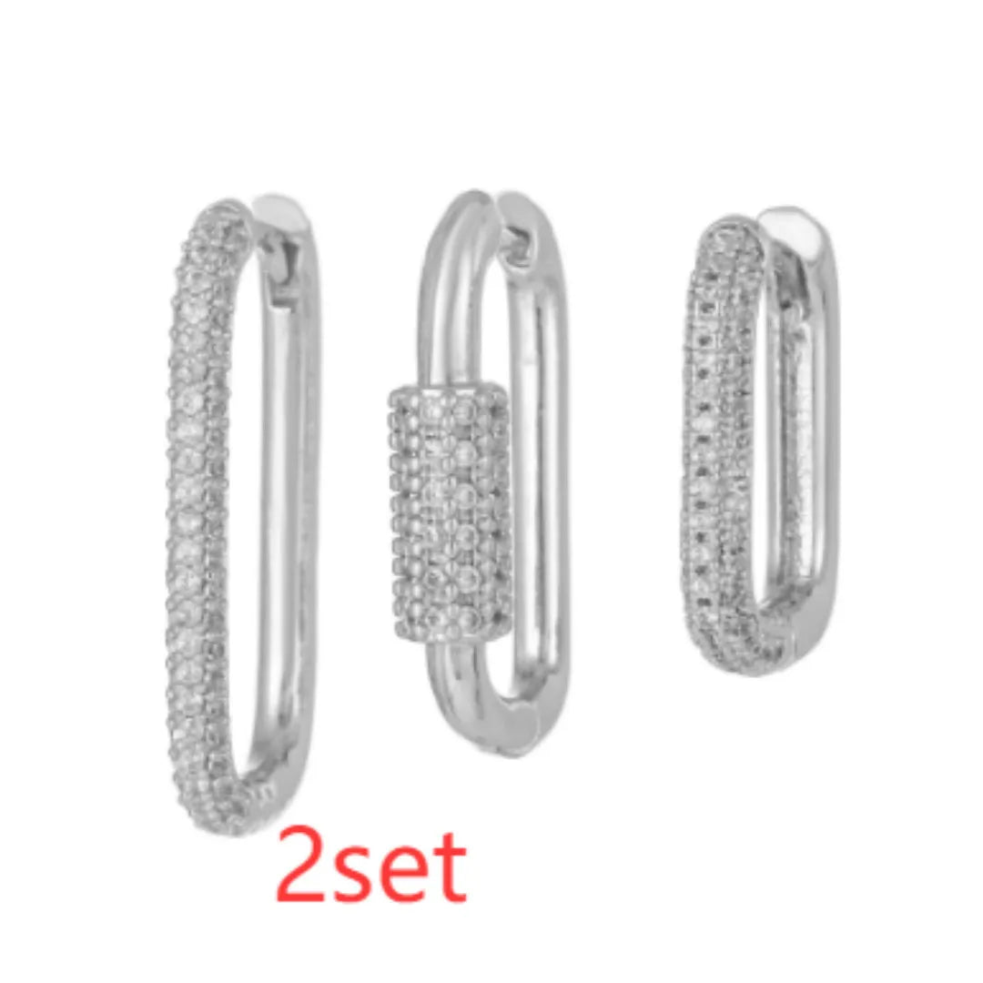 Geometric zircon ear clip set showing three square earrings with quadrilateral and ellipse designs