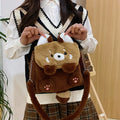 Brown coati plush bag doll cartoon backpack on display showing soft fabric and animal face design