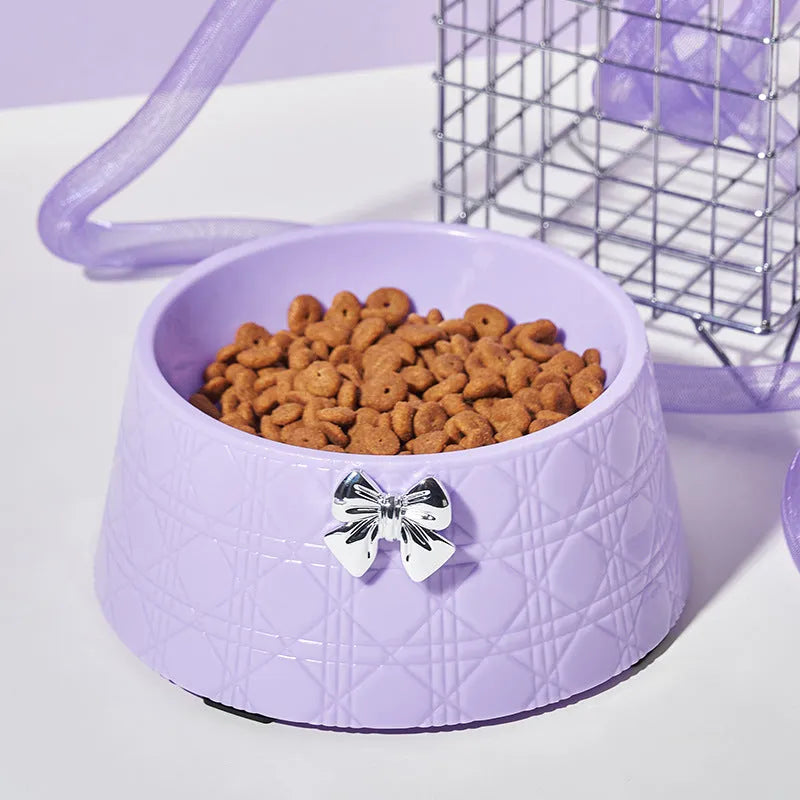 Ceramic pet bowl with diamond pattern and a bowknot decoration in pink, silver, black, purple, or white