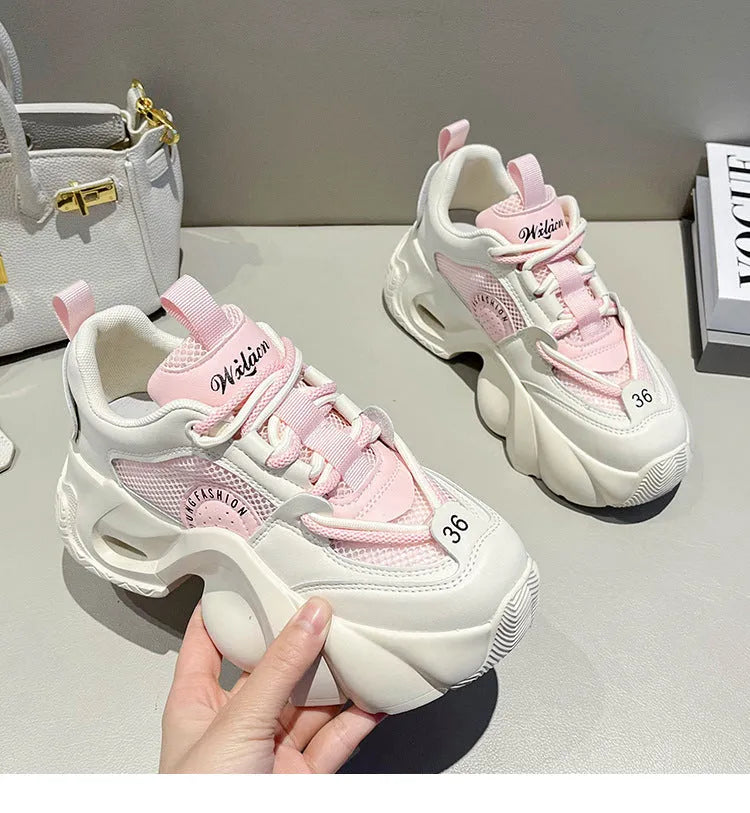 Women's beige casual sneakers with cross straps, thick sole, and mesh lining on a white background.