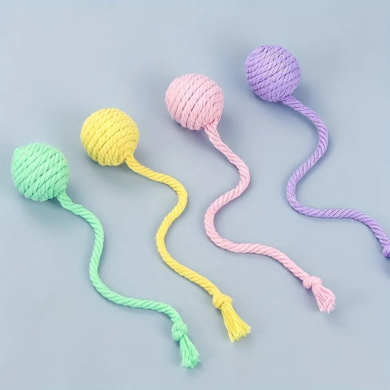 Cat toy ball with rope attached in green, pink, purple or yellow colour with internal bell
