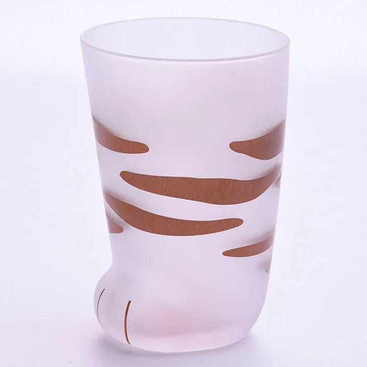 Creative cat paw shaped glass mug with 300ml capacity and frosted texture on a desk