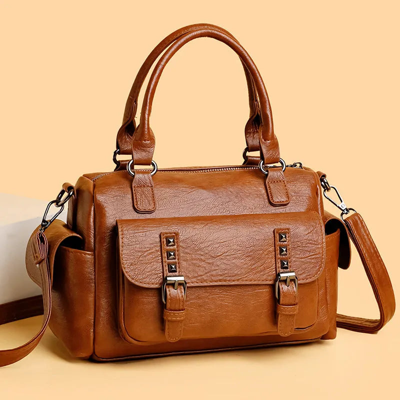 Vintage-style messenger bag in horizontal square shape with contrast stitching, shown in available colour options