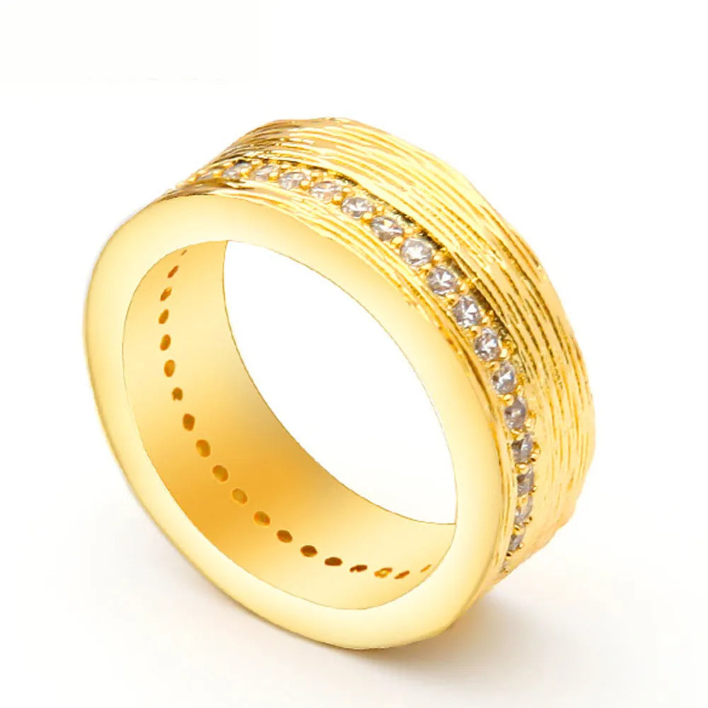 Gold geometric women's ring with zircon stone on copper base, electroplated finish.