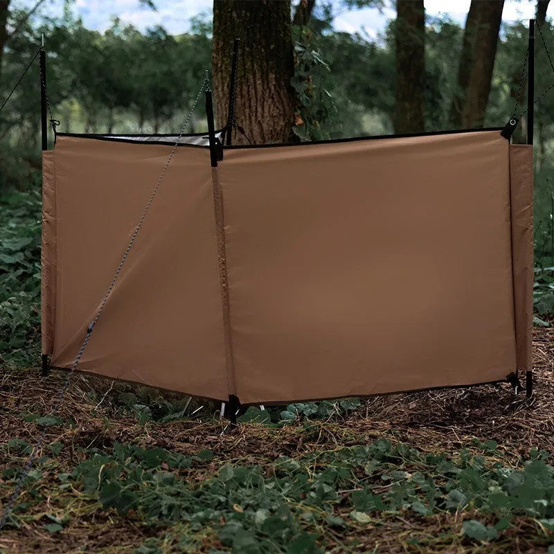 Oxford cloth camping windshield tent in Army Green with support poles and ground nails for outdoor stove cooking