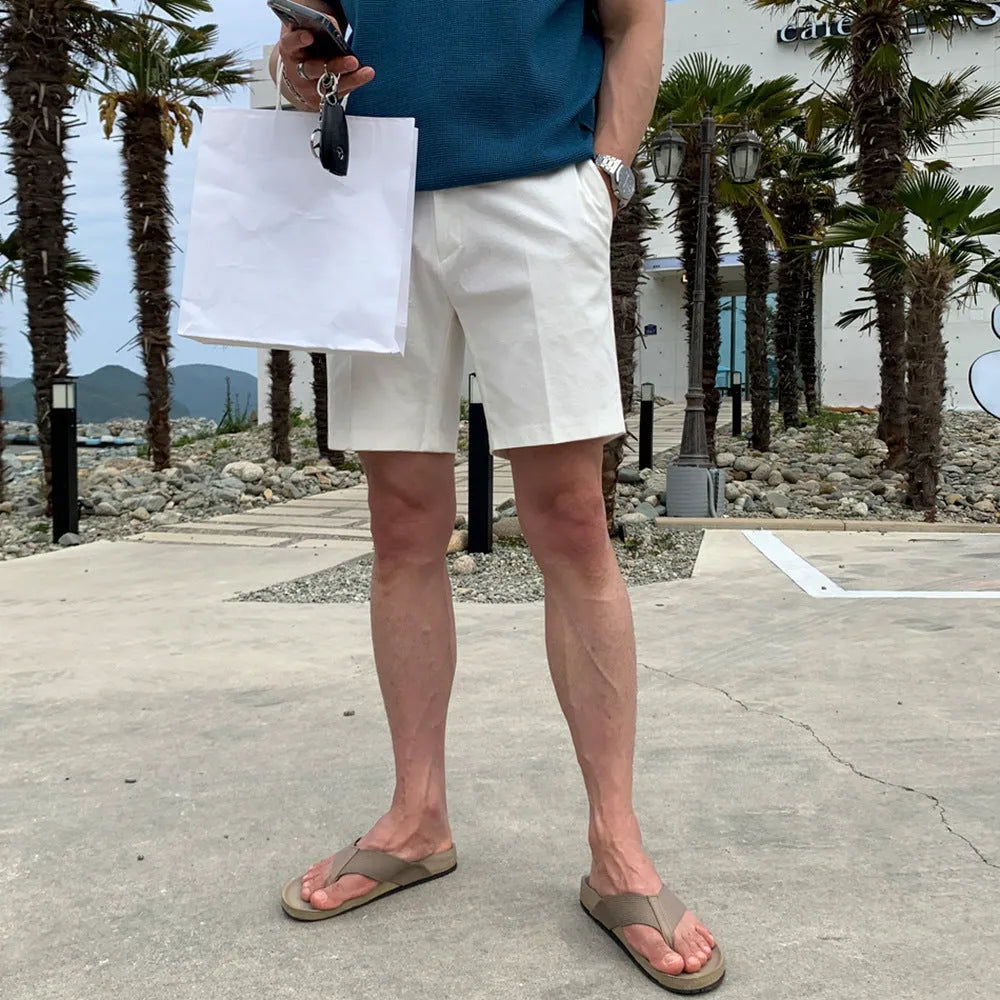Men's straight-leg casual shorts in solid black, shown laid flat, featuring a non-iron polyester fabric.