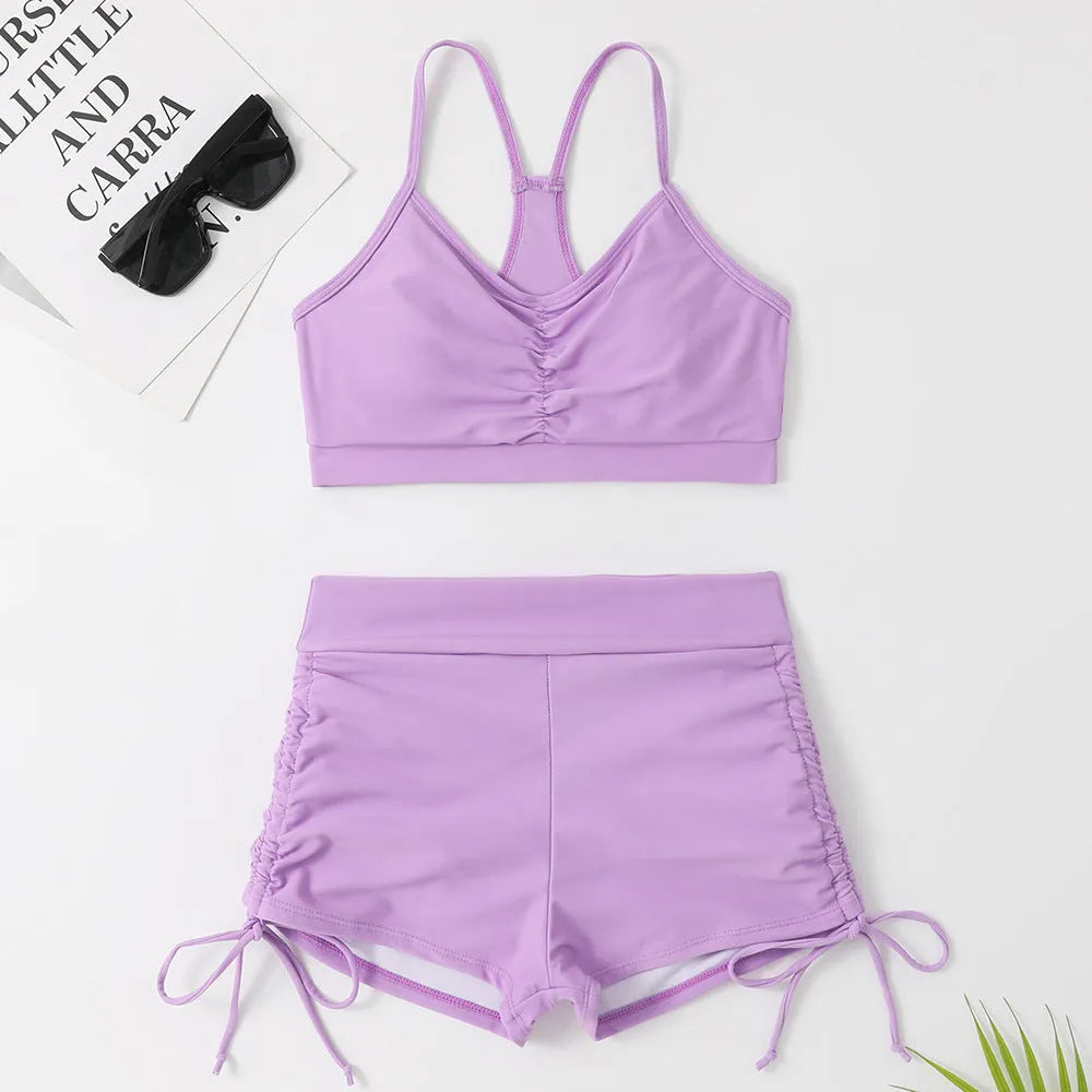 Women's high waist split bikini swimsuit in black or purple, made from nylon and spandex.
