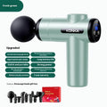 Konka V19 grey mini massage gun with set of eight different coloured massage heads on a table.