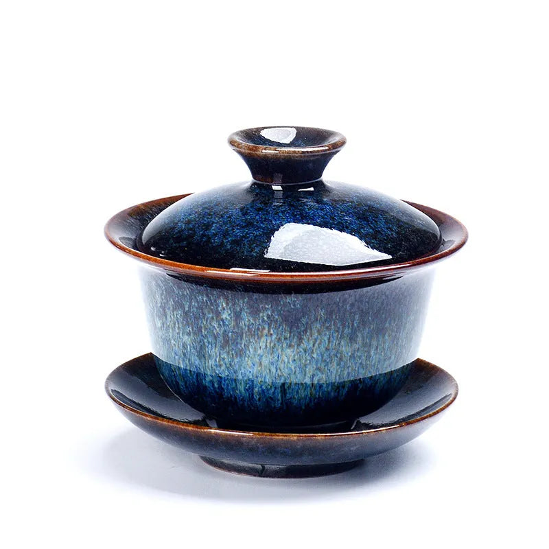 Handcrafted ceramic three-piece tea set with covered bowl and teacup in transmutation glaze finish
