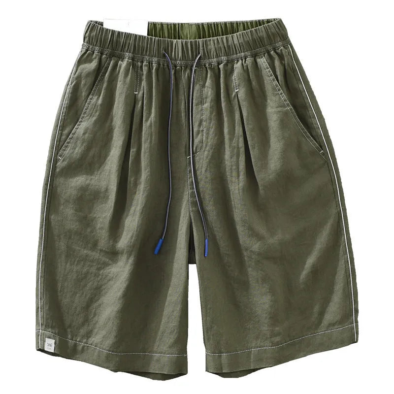 Men's loose straight leg linen shorts in green with drawstring waist and mid thigh length