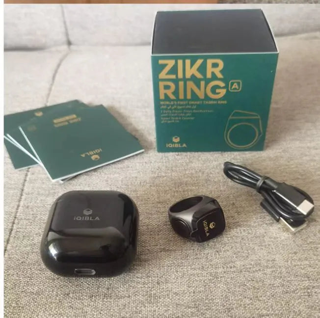 Zikr1 metal smart ring for Tasbih counting on a finger, showing its OLED display and single button.