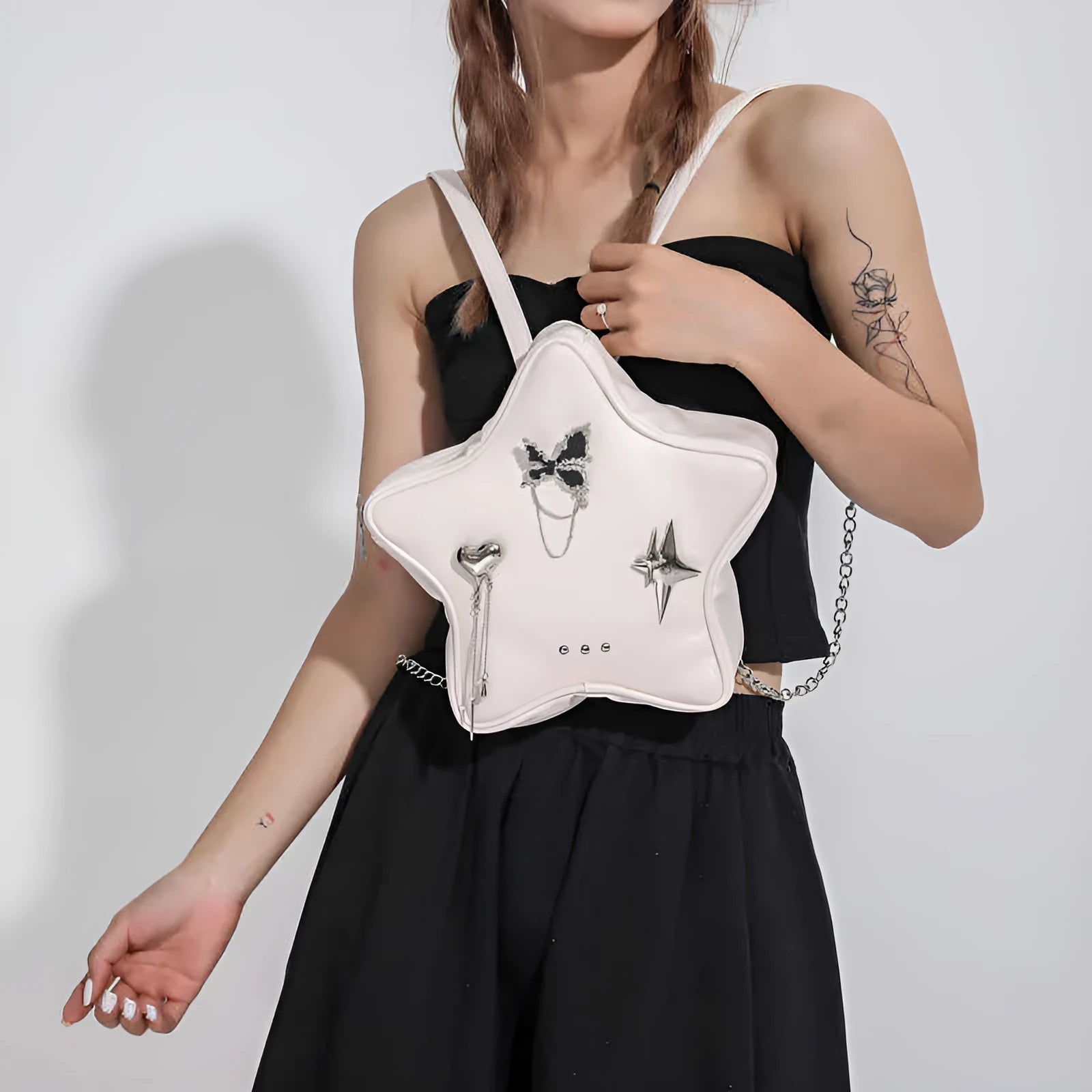 A soft PU leather women's messenger bag that can also be worn as a mini backpack, shown in a neutral colour.