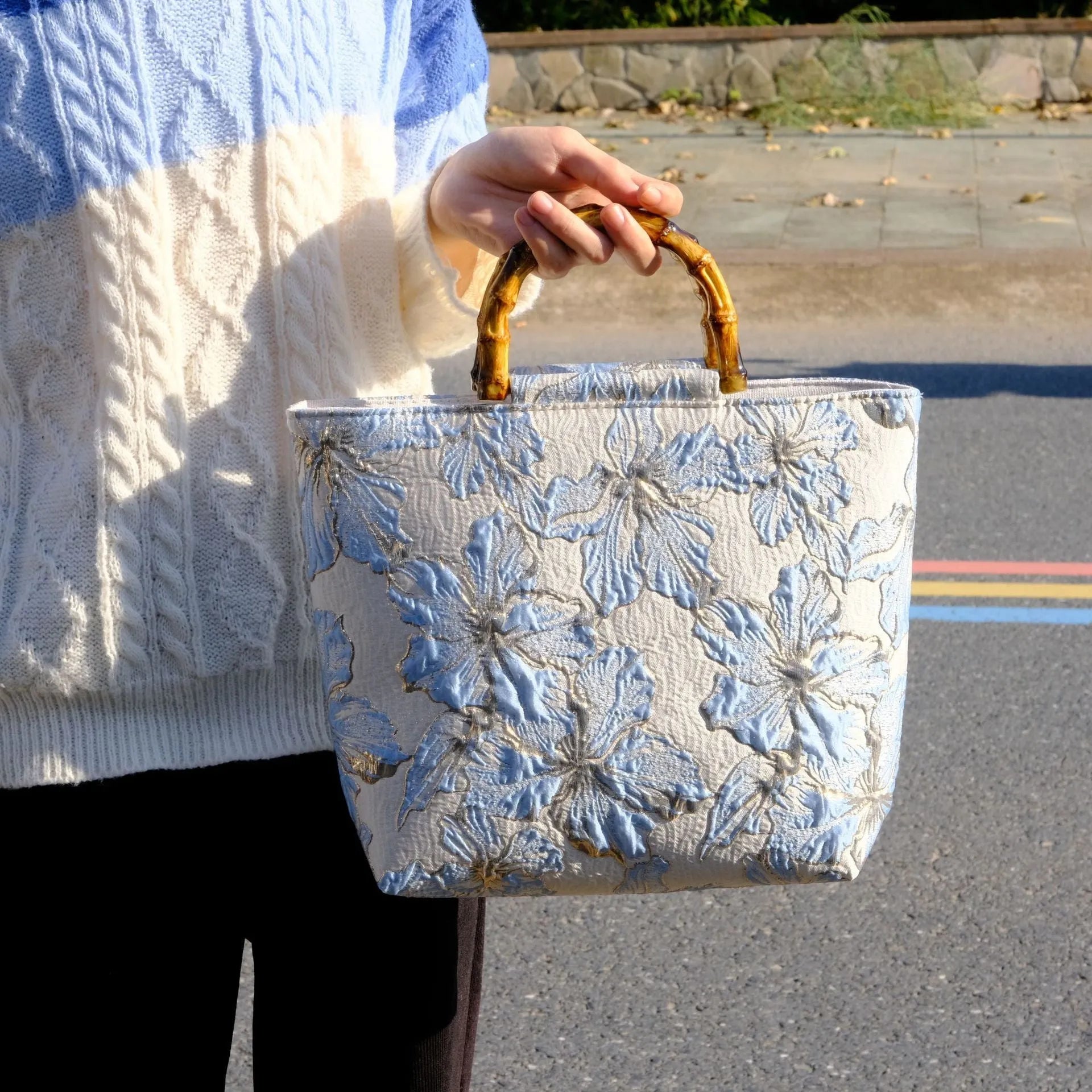 Light blue women's canvas bag with bronzing flower detail and double shoulder straps