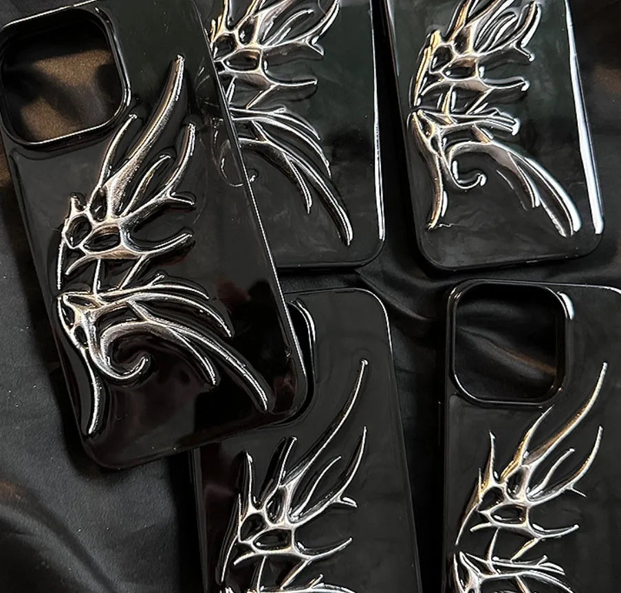 Black iPhone case with three-dimensional blurred wings design showing raised edges and precise port cutouts