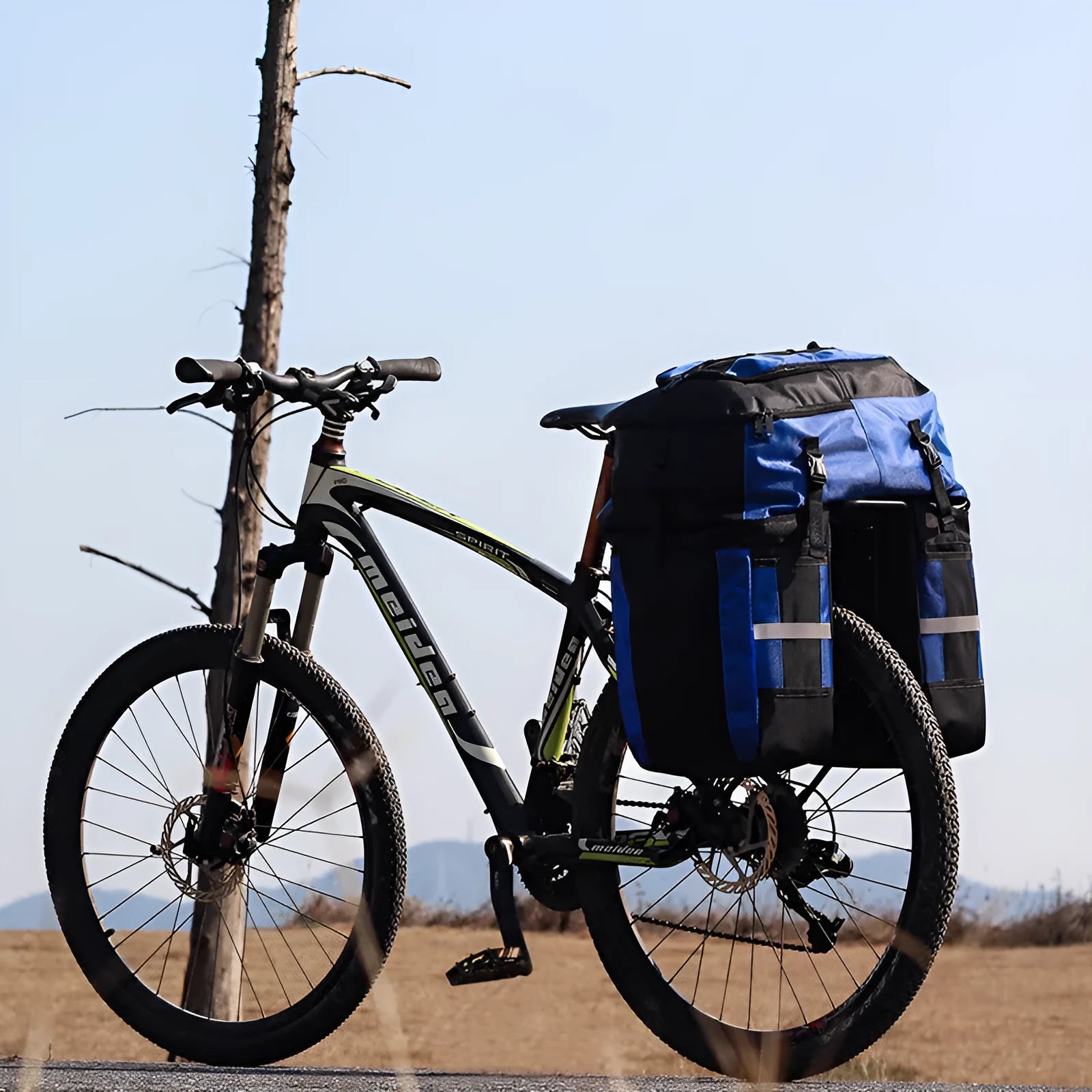 Rhinoceros 70-litre green bicycle rear storage bag mounted on a bike rack for touring.