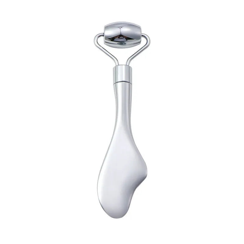 Stainless steel facial massage roller and heart-shaped gua sha scraping plate on a simple background.