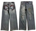 Grey washed wide-leg jeans with straight-leg workwear styling and mid-waist zip fly