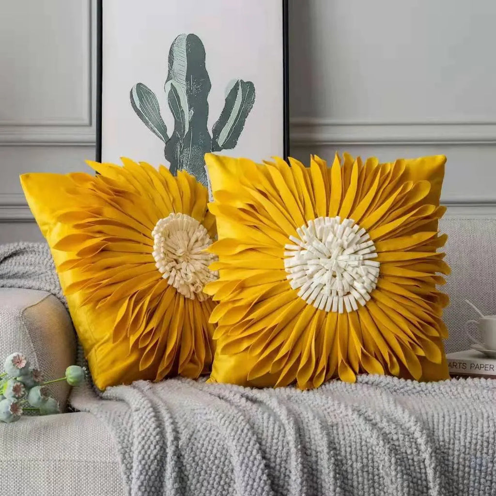 White polyester velvet cushion cover with blue chrysanthemum tufting pattern and fringed hem on a sofa