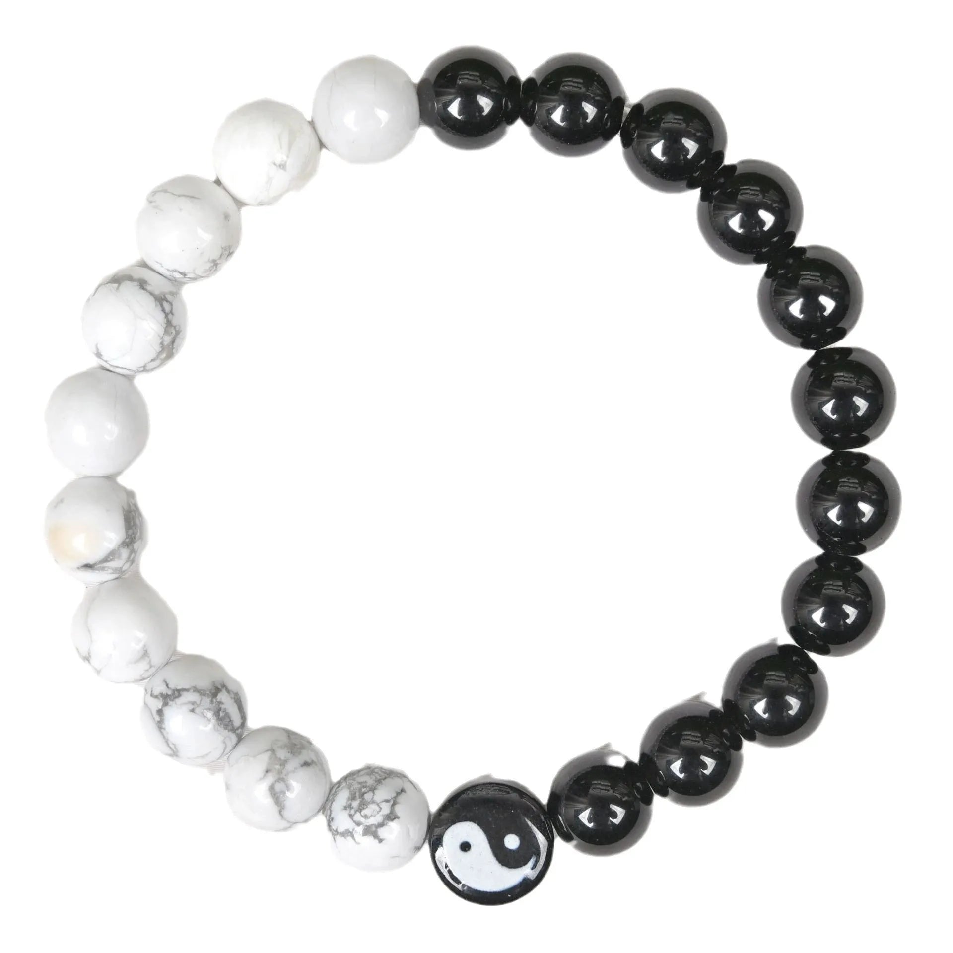 White turquoise and natural obsidian 8mm bead bracelet on a flat surface