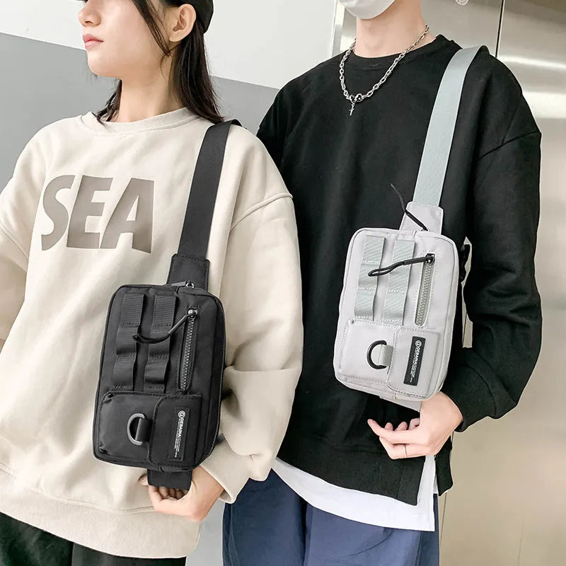 Tooling style crossbody bag in solid colour with wear-resistant nylon for outdoor sports use, below 20L capacity
