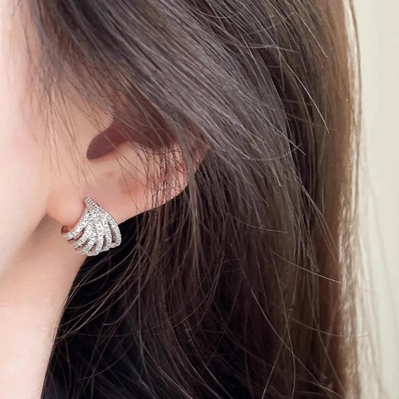 A pair of geometric line design drop earrings with a platinum colour finish.