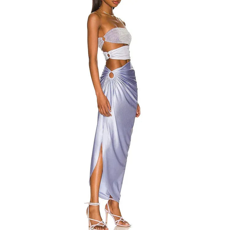 Purple women's one-piece swimsuit with a matching wrap skirt on a model, showing the quick-dry fabric and tight fit.