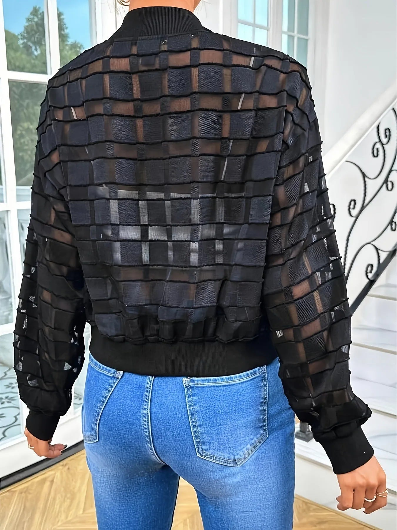 Black women's semi-transparent jacket with geometric pattern and front zipper
