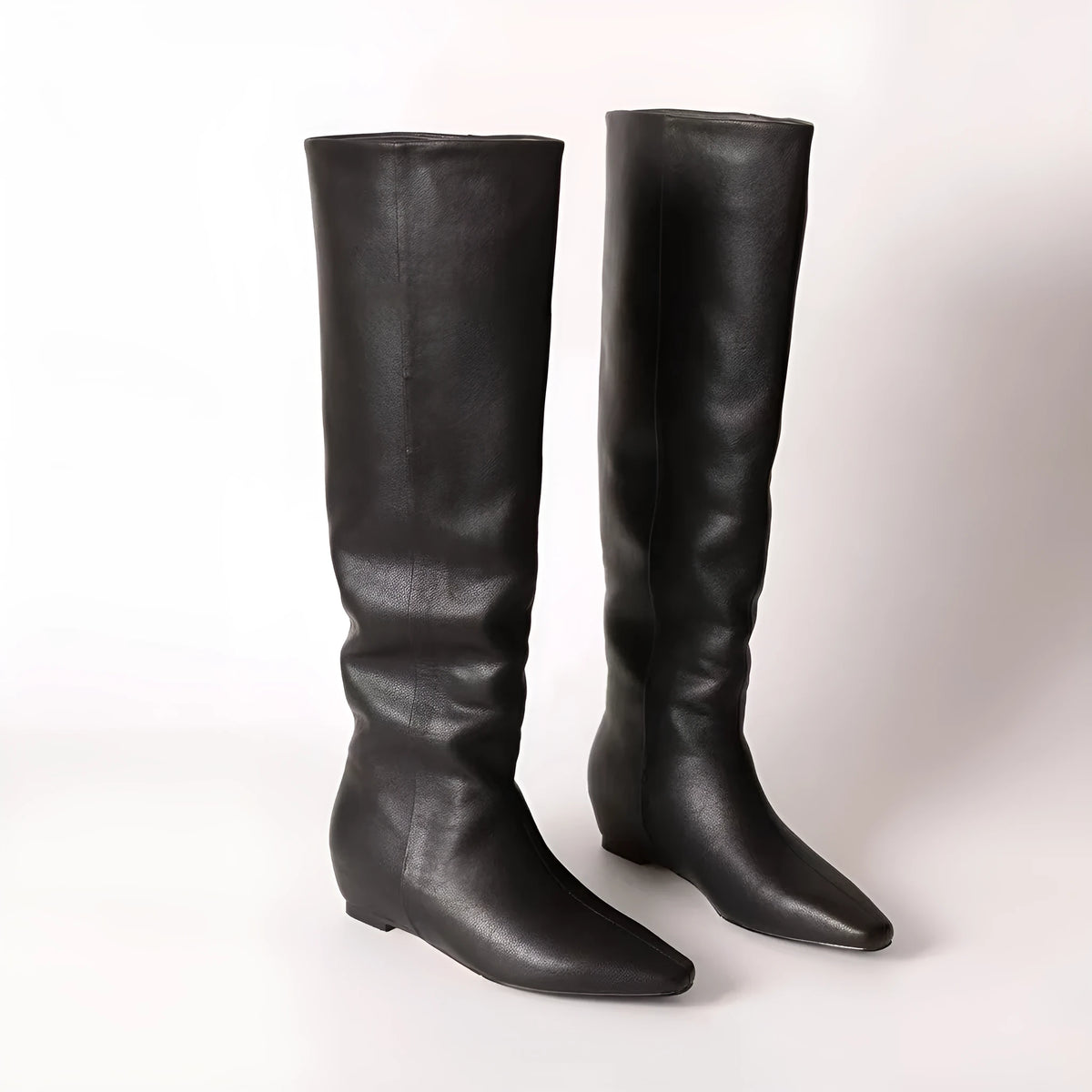 Retro style square toe tall knight boots in black with mid heel and cowhide upper