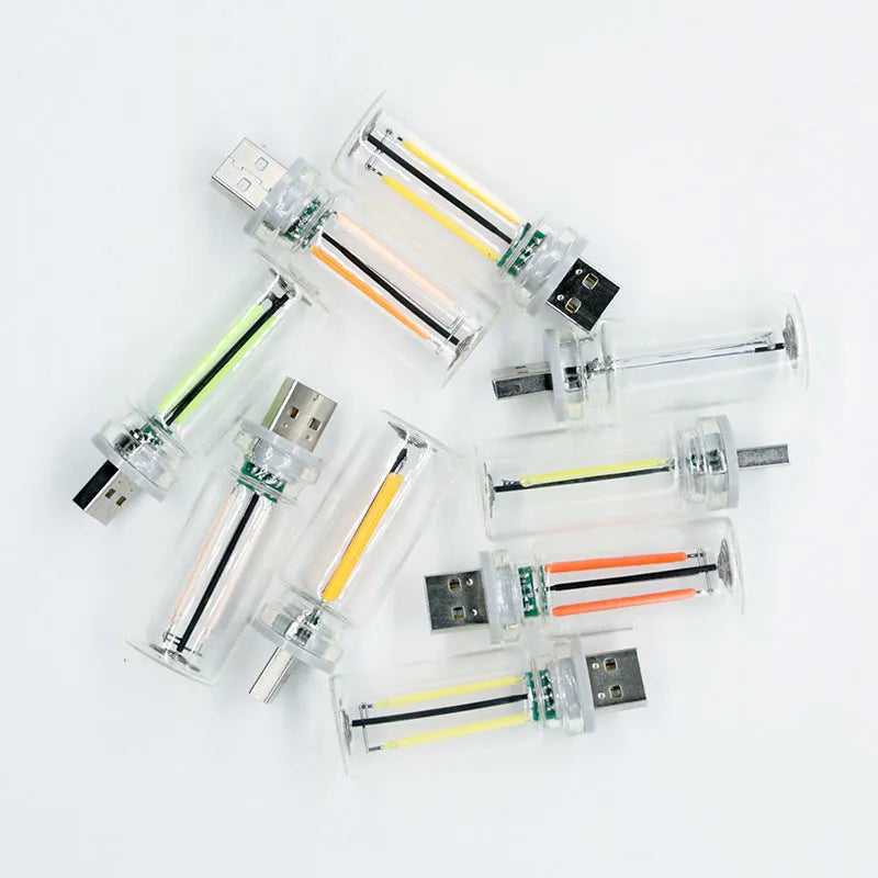 Transparent USB touch-controlled night lamp with compact 22x64mm glass construction