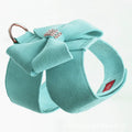 A pink microfiber dog harness with a decorative bowknot on the collar, sized for a small puppy.