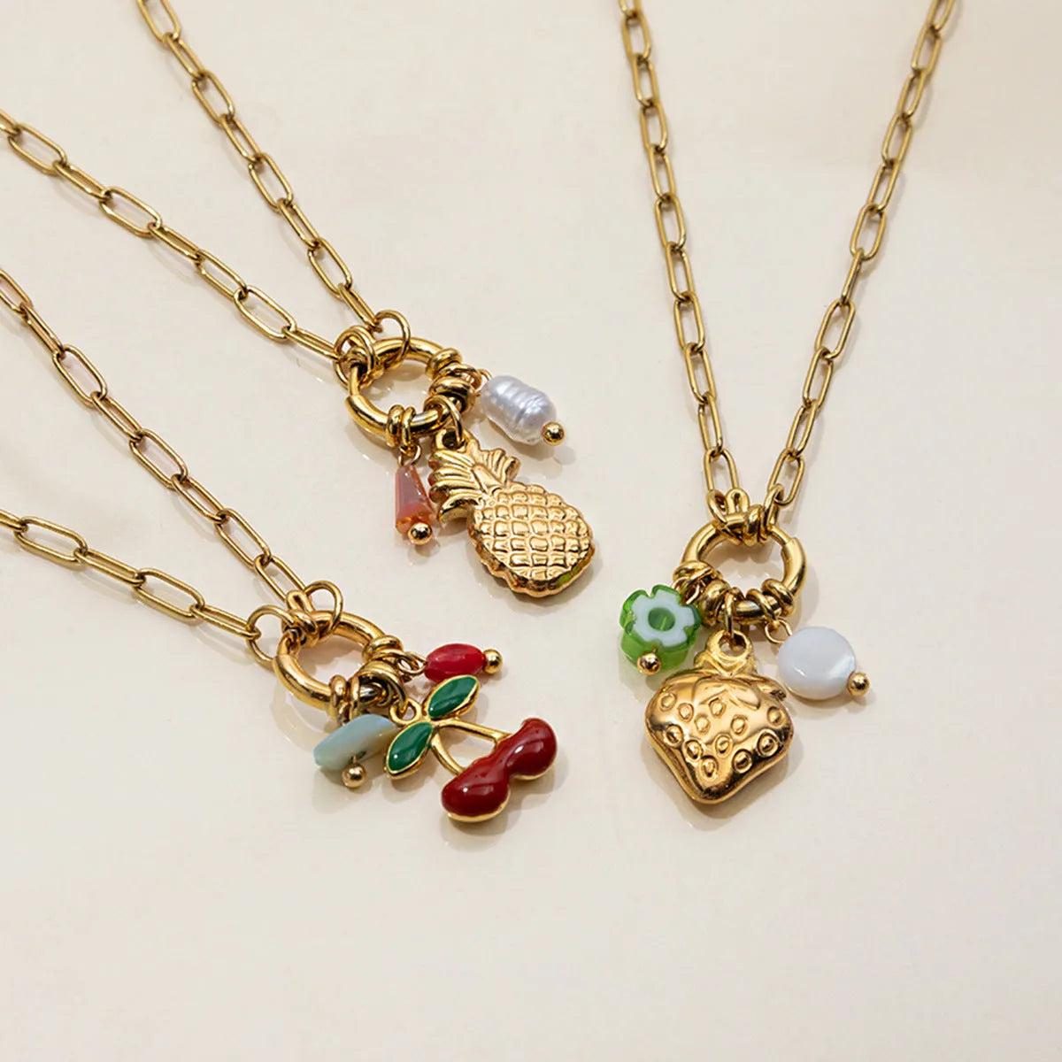 Stainless steel clavicle chain with geometric strawberry-shaped titanium steel pendant in non-fading finish