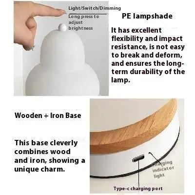 White pear-shaped rechargeable touch LED table lamp with PE shade on a wooden bedside table