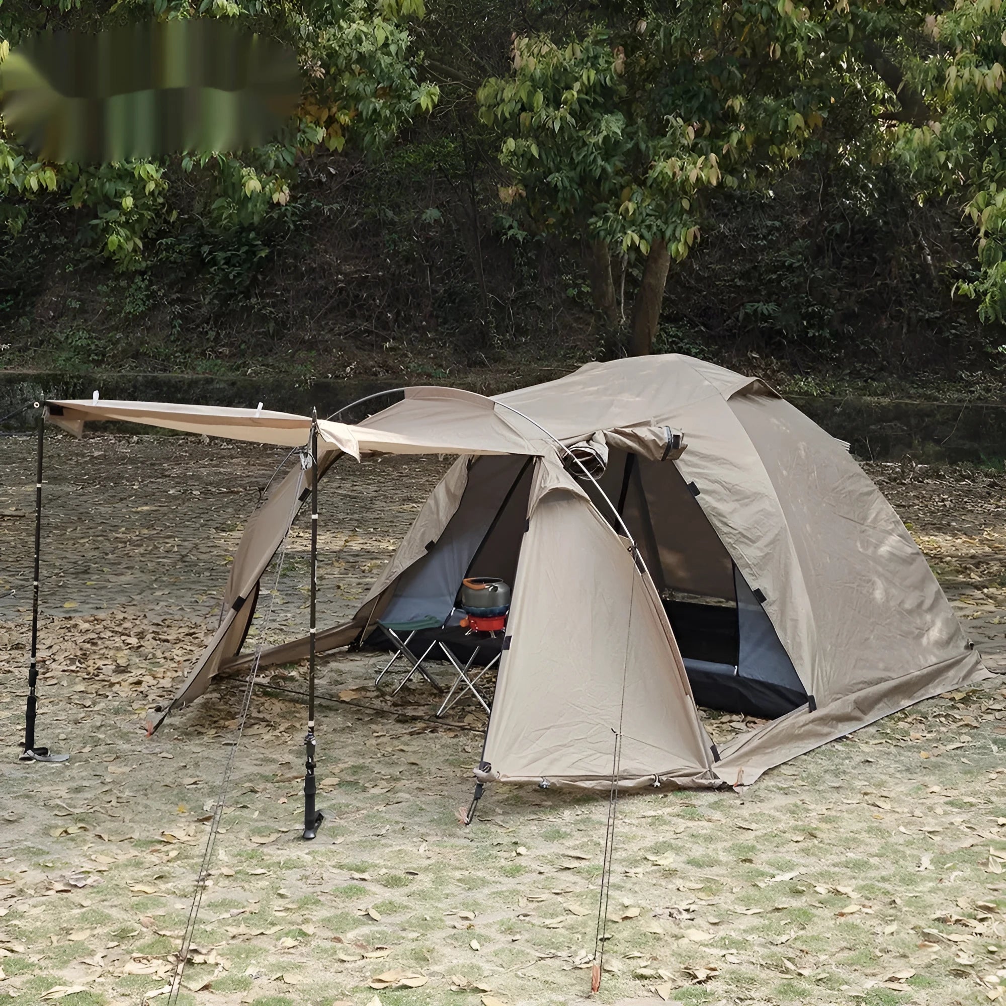 Double occupancy four-season tunnel tent with dome extension, olive green, pitched on grass with external and internal tents visible