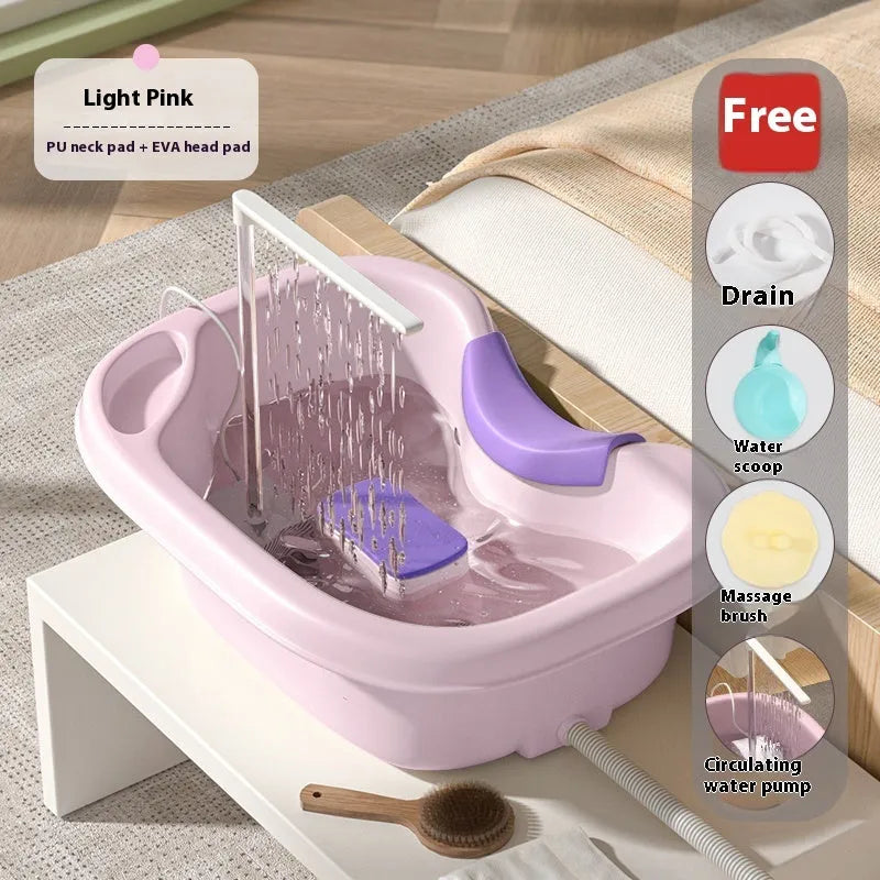 Portable shampoo basin set with circulating water pump and cushioned head support in light pink