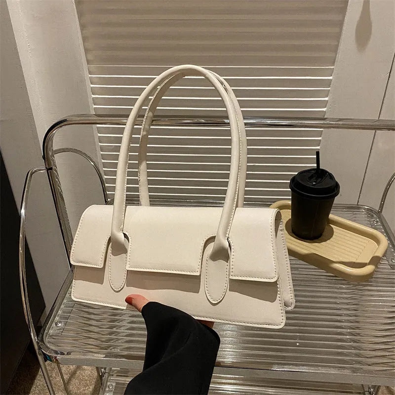 Women's retro small square bag in PU material with single shoulder strap and stitching details available in multiple colours