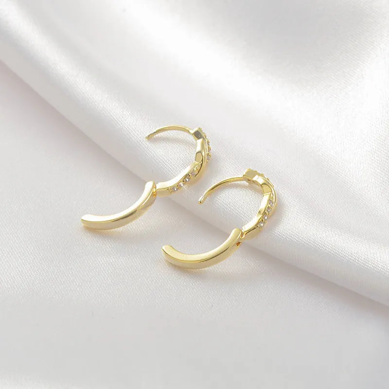 Geometric copper interwoven earrings with hemp rope design in gold or silver finish.