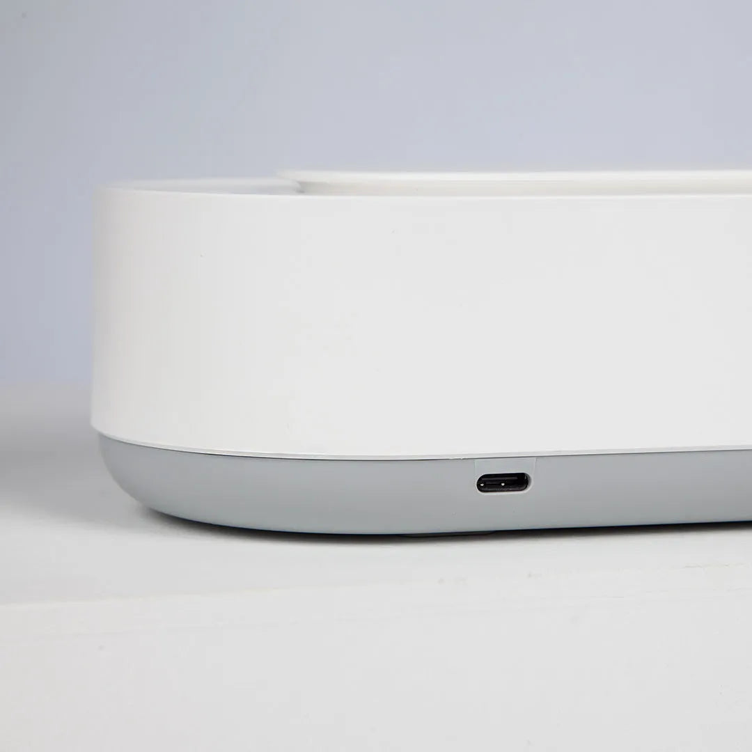 White portable ultrasonic cleaning machine with stainless steel tank and digital timer display.