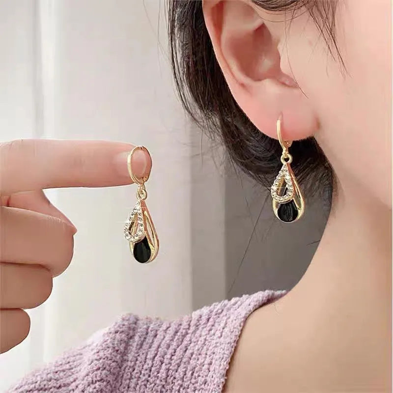Black diamond-inlaid drop earrings with hollow double-layer alloy droplet design for women