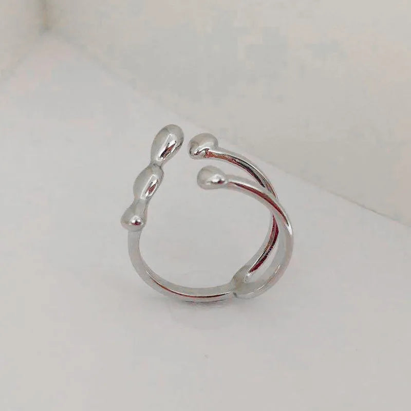 Brass spherical ring for women in gold or silver plating.