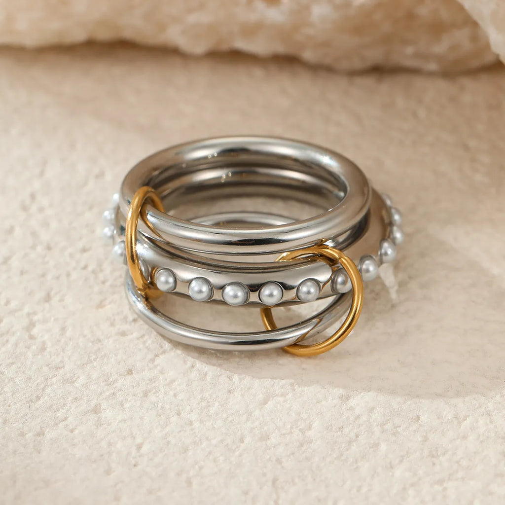 Stacked stainless steel rings with 18K gold plating in free size adjustable design